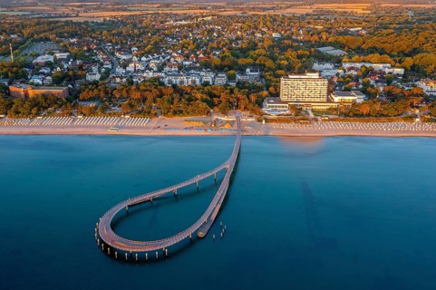 Aerial view over Maritim Seebrücke / maritime pier over the Baltic Sea at seaside resort