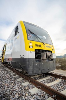 Close-up of a modern SWEG train on the rails, taking off the Hermann Hesse Railway, Calw, Black