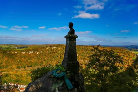 Wilhelm Hauff memorial, rocks above the Echaz Valley, monument from 1839, obelisk with bronze bust,