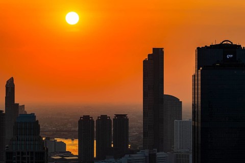 Over the rooftops of Bangkok, sunset, view from the Moon Bar on the roof terrace of the Banyan Tree