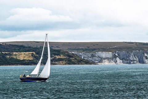 Boats over Hurst Point Lighthouse and Hurst Castle, Hurst Spit, Milford on Sea, Lymington,