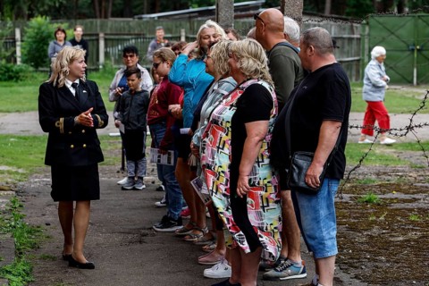 A guide explains the history of the prison in Karosta, Liepaja, Karosta, Latvia to a group