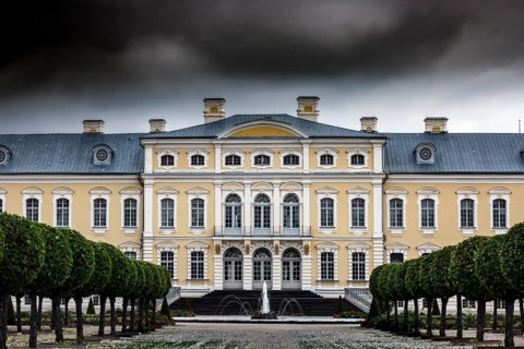 Magnificent baroque castle with imposing façade under dramatic clouds, Rundale, Latvia