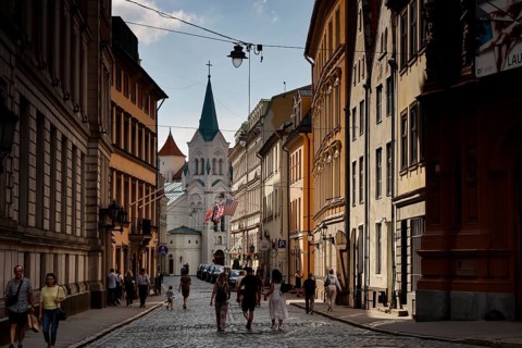 Castle Street with Maria Schmerzen Church and lively street life in Riga, Riga, Latvia