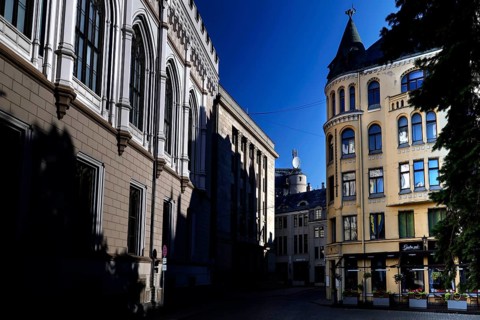 Large guild and cat house at Livu Square in Riga under deep blue sky, Riga, Latvia