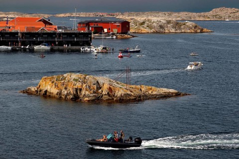 Busy water near Klädesholmen with boats and distinctive coastal cliffs, Klädesholmen, Sweden
