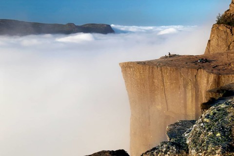 Breathtaking view from Prekestolen over a sea of clouds in a peaceful atmosphere