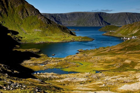 Landscape with fjord-like water and green slopes on Magerøya, Magerøya, Norway