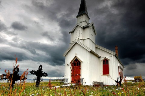 Historic church under stormy sky in Nesseby, Nesseby, Finnmark, Norway