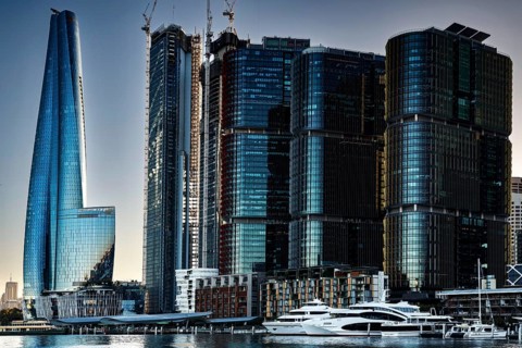 Futuristic skyscrapers in Sydney's Barangaroo are reflected in the water, Sydney, New South Wales,