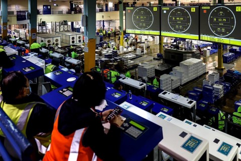 Interior view of a fish report with monitors and bidders in Sydney Fish Market, Sydney, New South