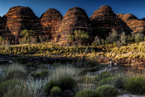 Game-shaped rock formations in an impressive landscape under a blue sky, zero