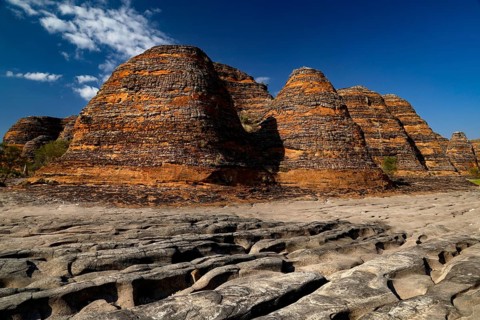 Spectacular Bungle Bungle rock formations rise from a dry riverbed, Purnululu National Park,