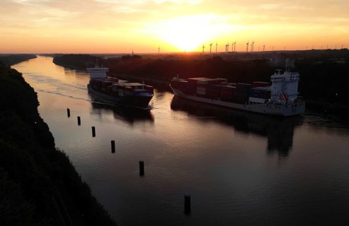 Drone shot, container ship at sunrise in the Kiel Canal, NOK, Kiel Canal, Kiel Canal,