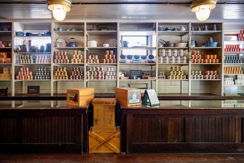 Interior view, historic restored Kennicott shopping store with historic goods display, retro food