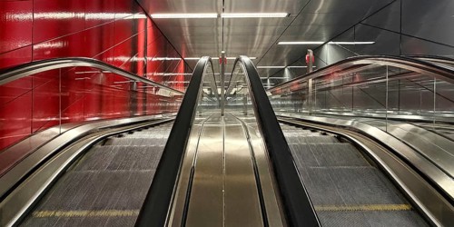 Artwork titled Three Model Spaces by Ralf Brög, escalators at Heinrich-Heine-Allee subway station,