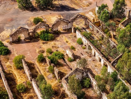Ruins of former workshop halls, Mina de Sao Domingos, historic copper open-pit mine, aerial view,