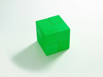 8 green wooden cubes against a white background