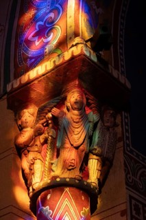 Issoire. Pillar (The Annunciation made to Mary) . The figures are illuminated by colorful light