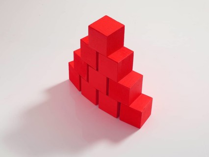 10 red wooden cubes against a white background
