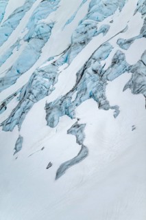 Blue rugged glacier ice with crevasses and snow, detail, Exit Glacier, Kenai Peninsula, Alaska, USA