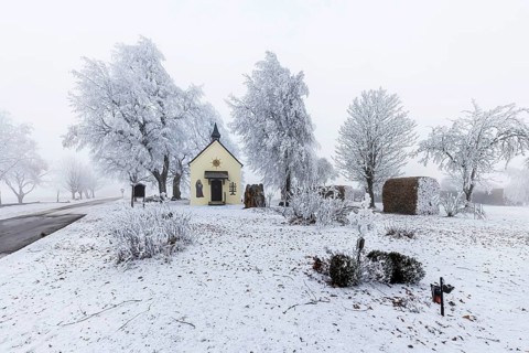 Schoenstatt Chapel Ennabeuren with hoarfrost in winter. Tourist attraction in the Swabian Jura.