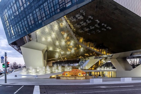Highlights on Porscheplatz in Zuffenhausen. In front of the Porsche Museum and the car