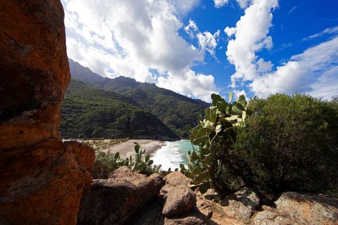 View of the pebble beach and Porto Bay, a UNESCO World Heritage Site, Ota, west coast of Corsica,