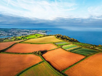 Colours of autumn Fields and Farms over Sheldon from a drone, Torbay, Devon, England, United
