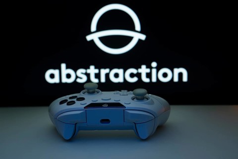 Dhaka, Bangladesh- 08 Apr 2025: A gaming controller in front of a Abstraction screen