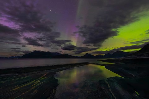 The Vestfjord in Nordland, Norway, has an enchanting atmosphere at night. Dark clouds and vivid