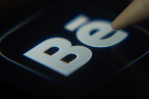 Dhaka, Bangladesh- 06 Dec 2025: Close-up of the Behance app on a screen with a stylus pointing at