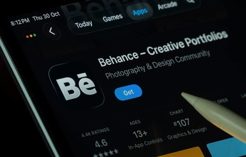 Dhaka, Bangladesh- 30 Oct 2025: Behance app displayed on a iPad screen in dark mode with a digital