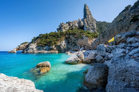 Light blue clear sea on a dream beach on Cala Goloritzé, picturesque rocky coast, steep coast with