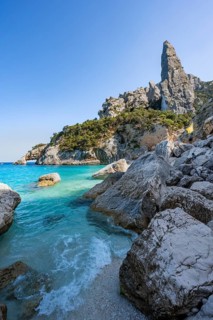 Light blue clear sea on a dream beach on Cala Goloritzé, picturesque rocky coast, steep coast with
