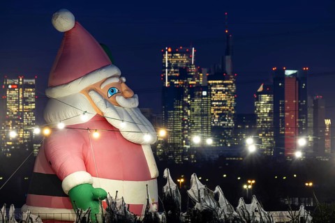In a Christmas tree center near Frankfurt am Main, a multi-metre-high inflated figure of Santa