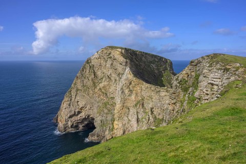 View of blue sea and cliffs with rock gate from Portacloy Loop Cliff Walk, Muingnabo, County Mayo,