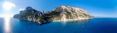 Panorama, picturesque rocky coast, cliffs with L'Aguglia pinnacle, blue sea and Cala Goloritzé