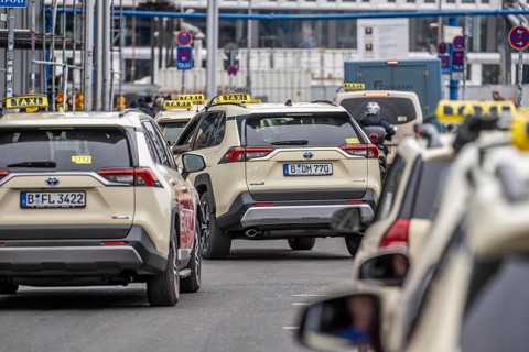 Taxis in front of the main train station in Berlin, waiting in line for passengers, Germany