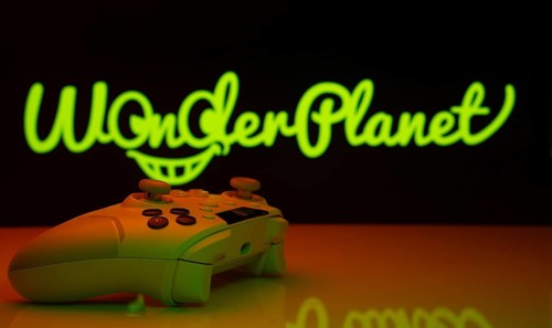 Dhaka, Bangladesh- 14 Nov 2025: A close-up of a white gamepad with the WonderPlanet Inc seen on