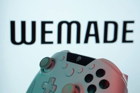 Dhaka, Bangladesh- 14 Nov 2025: A close-up of a gamepad with the WeMade Entertainment seen on