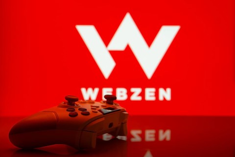 Dhaka, Bangladesh- 14 Nov 2025: A close-up of a white gamepad with the Webzen seen on screen in the
