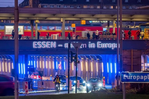 The main train station in Essen, blue-lit underpass, bus station, am Europaplatz, public transport
