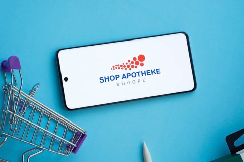 Dhaka, Bangladesh- 21 Nov 2025: Smartphone displaying Shop Apotheke logo with shopping cart on a