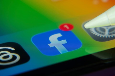 16 Nov 2025- Dhaka, Bangladesh: Stylus touching the Facebook app icon with a notification on a