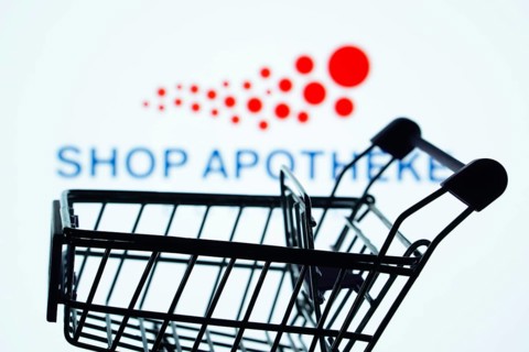 Dhaka, Bangladesh- 21 Nov 2025: Silhouette of a shopping cart in front of the Shop Apotheke logo,