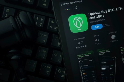 Dhaka, Bangladesh- 28 Oct 2025: An iPad displaying the Uphold app against a judge's gavel and dark
