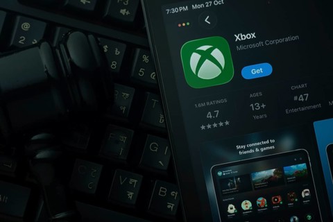 Dhaka, Bangladesh- 28 Oct 2025: An iPad displaying the Xbox app against a judge's gavel and dark