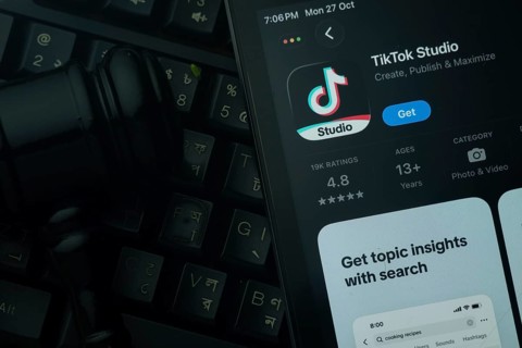 Dhaka, Bangladesh- 28 Oct 2025: An iPad displaying the tiktok Studio app against a judge's gavel