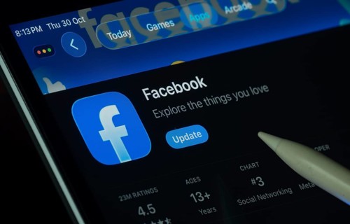 Dhaka, Bangladesh- 30 Oct 2025: Facebook app displayed on a iPad screen in dark mode with a digital